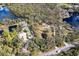 Aerial view of property, showcasing the house, lake, and surrounding land at 7321 Proctor Rd, Sarasota, FL 34241