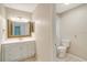 Clean bathroom with vanity, toilet and tiled flooring at 7321 Proctor Rd, Sarasota, FL 34241