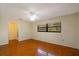 Bedroom with wood floors, window and access to bathroom at 7321 Proctor Rd, Sarasota, FL 34241