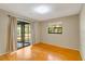 Bedroom with wood floors, sliding glass doors and window with view at 7321 Proctor Rd, Sarasota, FL 34241