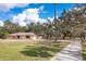 One-story home with a long driveway and lush landscaping at 7321 Proctor Rd, Sarasota, FL 34241