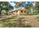 Side view of the house showcasing its unique features at 7321 Proctor Rd, Sarasota, FL 34241