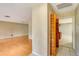 View of hallway with wood floors and access to kitchen and other rooms at 7321 Proctor Rd, Sarasota, FL 34241