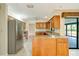 Kitchen features an island, granite countertops, and stainless steel appliances at 7321 Proctor Rd, Sarasota, FL 34241
