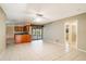 Living area with tile floors, leading to the kitchen and backyard at 7321 Proctor Rd, Sarasota, FL 34241