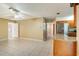 Open living room with tile floors and access to the kitchen and back patio at 7321 Proctor Rd, Sarasota, FL 34241
