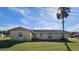 Rear view of a single-story house with a spacious lawn at 924 31St E St, Palmetto, FL 34221