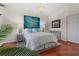 Serene bedroom featuring hardwood floors and tasteful furnishings at 1188 N Tamiami Trl # 305, Sarasota, FL 34236