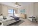 Ocean view bedroom with king bed, seating, and dresser at 19 Whispering Sands Dr # 103, Sarasota, FL 34242