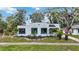 Charming house with white stucco and a beautifully landscaped yard at 2509 14Th W Ave, Bradenton, FL 34205
