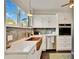 Stylish kitchen with copper farmhouse sink and stainless steel appliances at 2509 14Th W Ave, Bradenton, FL 34205