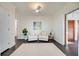 Sitting area with two white armchairs, a rug, and ceiling fan at 2509 14Th W Ave, Bradenton, FL 34205
