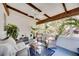 Bright sunroom with wicker furniture, exposed beams, and ample natural light at 2509 14Th W Ave, Bradenton, FL 34205