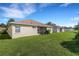 Tan house with screened patio and grassy backyard at 3114 43Rd E Ave, Bradenton, FL 34208
