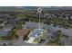 Highlighted lakefront home features a pristine pool and meticulously landscaped yard at 4742 Balboa Park Loop, Bradenton, FL 34211