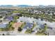 Aerial view showcases waterfront homes, mature trees, and a serene lake at 4742 Balboa Park Loop, Bradenton, FL 34211