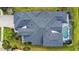 Aerial view of home showing roof, driveway, pool and landscaping at 4742 Balboa Park Loop, Bradenton, FL 34211