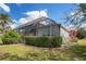 The backyard features lush landscaping and a screened enclosure for outdoor enjoyment at 4742 Balboa Park Loop, Bradenton, FL 34211