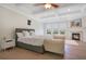 Bright bedroom featuring a fireplace, trey ceiling and hardwood floors at 4742 Balboa Park Loop, Bradenton, FL 34211
