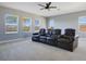 Comfortable entertainment room with comfortable reclining seating and natural light from the bright windows at 4742 Balboa Park Loop, Bradenton, FL 34211