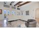 Spacious living room with natural light, hardwood floors, and a comfortable seating area with leather chair at 4742 Balboa Park Loop, Bradenton, FL 34211