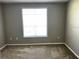 Bedroom with a window allowing natural light and carpet flooring at 4802 51St W St # 1406, Bradenton, FL 34210