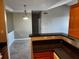 This home has a dining area with a modern light fixture and an opening to the kitchen area at 4802 51St W St # 1406, Bradenton, FL 34210
