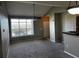 This living area has a ceiling fan, gray paint, and carpet, and a large window for ample natural light at 4802 51St W St # 1406, Bradenton, FL 34210