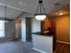 This living area has a ceiling fan, gray paint, and carpet, with a view into the kitchen area at 4802 51St W St # 1406, Bradenton, FL 34210