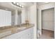 Bathroom features granite countertops and a walk-in closet at 5560 Rosehill Rd # 201, Sarasota, FL 34233