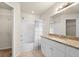 Bathroom with granite countertop, white cabinets, and bathtub at 5560 Rosehill Rd # 201, Sarasota, FL 34233