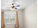 Bedroom with large window and neutral decor at 5560 Rosehill Rd # 201, Sarasota, FL 34233