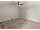Spacious bonus room with a ceiling fan and neutral walls at 5560 Rosehill Rd # 201, Sarasota, FL 34233