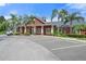 Community center with ample parking and a welcoming exterior at 5560 Rosehill Rd # 201, Sarasota, FL 34233
