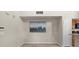 Small carpeted dining area with a wall-mounted artwork at 5560 Rosehill Rd # 201, Sarasota, FL 34233