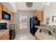 Modern kitchen with granite countertops and black appliances at 5560 Rosehill Rd # 201, Sarasota, FL 34233