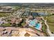 Aerial view of community with pool, clubhouse, golf course, and tennis courts at 5830 Wake Forest Run # 102, Bradenton, FL 34211