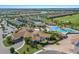 Aerial view of community amenities including pool and tennis courts at 5830 Wake Forest Run # 102, Bradenton, FL 34211