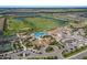 Resort-style community with pool, tennis courts, and golf course at 5830 Wake Forest Run # 102, Bradenton, FL 34211