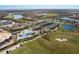 Community overview featuring clubhouse, pool, and tennis courts at 5830 Wake Forest Run # 102, Bradenton, FL 34211