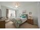 Spacious bedroom with a ceiling fan and large window at 5830 Wake Forest Run # 102, Bradenton, FL 34211
