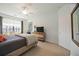 Bedroom with queen bed, TV, and window coverings at 5830 Wake Forest Run # 102, Bradenton, FL 34211