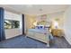 Primary bedroom with king-size bed and blue decor at 5830 Wake Forest Run # 102, Bradenton, FL 34211