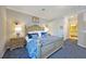 Primary bedroom with king bed and ensuite bathroom at 5830 Wake Forest Run # 102, Bradenton, FL 34211