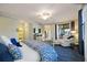 Primary bedroom with king bed, access to balcony at 5830 Wake Forest Run # 102, Bradenton, FL 34211