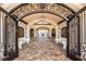 Ornate entrance with iron gates leading into a spacious lobby at 5830 Wake Forest Run # 102, Bradenton, FL 34211