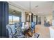 Sunlit dining area with a view and access to a bedroom at 5830 Wake Forest Run # 102, Bradenton, FL 34211