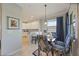 Bright dining area with kitchen access and large window views at 5830 Wake Forest Run # 102, Bradenton, FL 34211