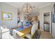 Bright dining room featuring a rustic wooden table and global chandelier at 5830 Wake Forest Run # 102, Bradenton, FL 34211