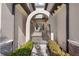 Ornate arched gate leads to private courtyard entry at 5830 Wake Forest Run # 102, Bradenton, FL 34211